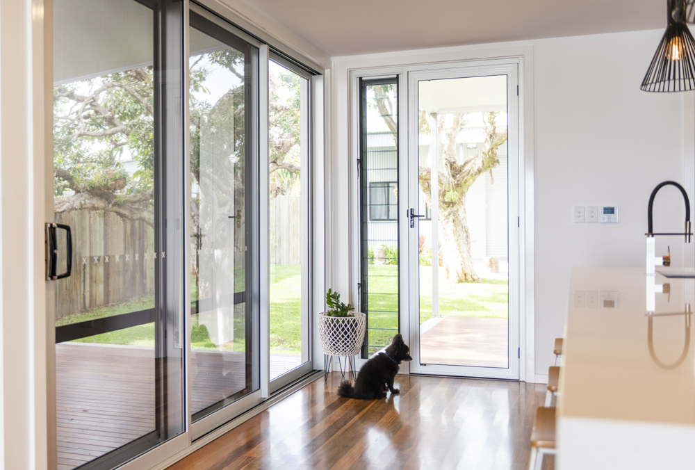 549 Series Internal Hinged Aluminium Door with Louvre Sidelight. And dog...